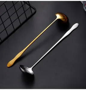 Detailed close-up showing long handle gold and silver stainless steel ladles for cooking