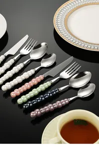 Elegant 304 stainless steel cutlery set with colorful pearl beaded ceramic handles.