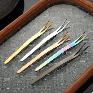 Elegant set of five colorful stainless steel two-tined fruit forks for desserts