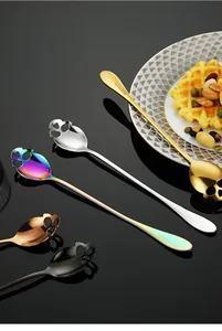 Polished skull-shaped stainless steel long handle spoons in gold, silver, and rainbow colors