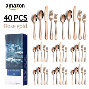 40-piece rose gold stainless steel cutlery set neatly arranged next to its blue gift box