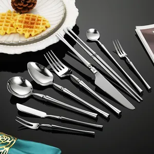 High-end 304 stainless steel cutlery set with elegant waistline design and polished finish.