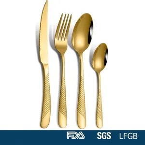 Detailed view of 4-piece gold stainless steel cutlery set with textured handles.