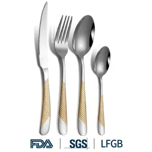 Close-up of stainless steel cutlery set with elegant gold-textured handles