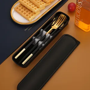 Portable 304 stainless steel black and gold cutlery set with a travel storage box