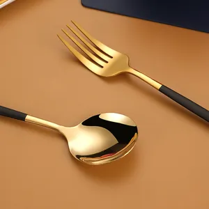 Premium 304 stainless steel golden cutlery set with elegant matte black handles for dining