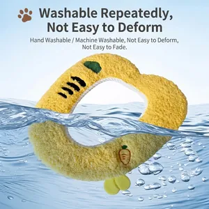 Yellow washable plush toilet seat cover with cute carrot embroidery shown in water splash