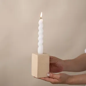 Ceramic pillar candle holder with white spiral candle