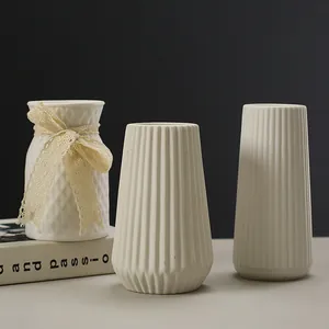Elegant set of 3 white ceramic vases with striped and textured designs for home decor