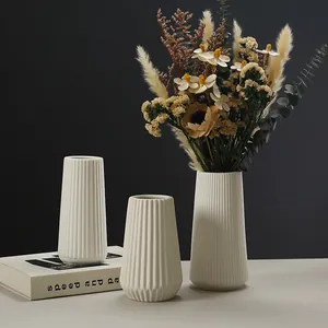 Modern white ceramic striped vases set for minimalist home and office decoration