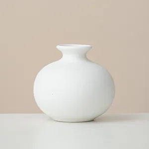 Modern minimalist round white ceramic flower vase ornament for elegant home table decor