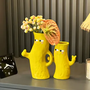 Decorative hand-in-hand yellow ceramic vases set for modern minimalist home decor
