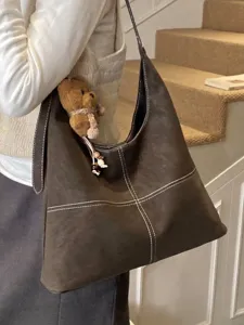 Bolso tote vintage marrón oscuro para mujer con costuras blancas decorativas y oso