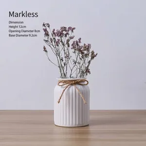 Small white ribbed ceramic vase with hemp rope bow for dried flower arrangement