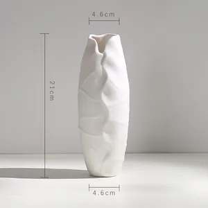 Modern white ceramic vase with leaf texture, measuring 21cm height and 4.6cm width