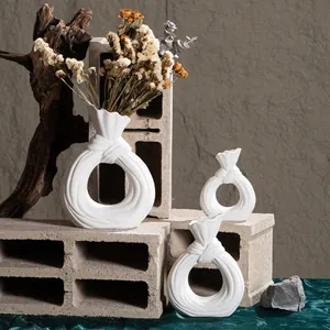 Set of 3 white circular ceramic vases with creative bag-style neck for home decor