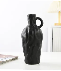 Vase en céramique noire texturée minimaliste avec anse pour décoration