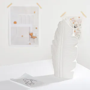 Minimalist white ceramic leaf-shaped vase for modern home decor and dried flowers