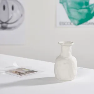 Minimalist white textured ceramic vase perfect for home decor and elegant floral displays