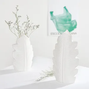 Minimalist white ceramic leaf-shaped vases for elegant home decoration and flowers