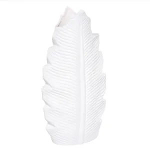 Minimalist white ceramic leaf-shaped vase for modern home decor and floral display