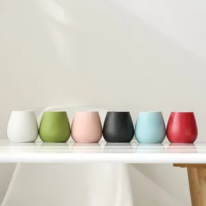 Set of six colorful mini ceramic vases for modern home decoration and flowers