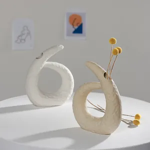 Nordic minimalist ceramic vases in white and beige with textured circular design