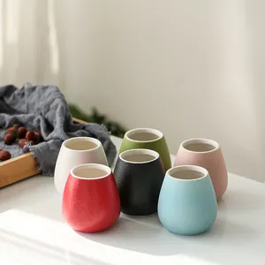 Set of six modern colorful mini ceramic vases for minimalist flowers and home decoration