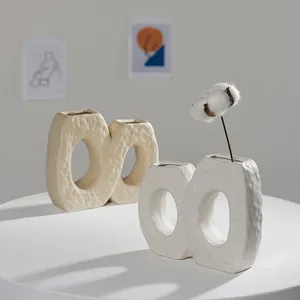 Nordic minimalist white textured ceramic vase with unique infinity shape for modern home decor