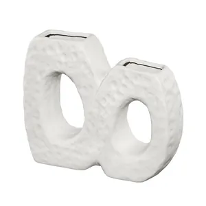Modern Nordic white textured ceramic vase with an elegant interlocking ring design