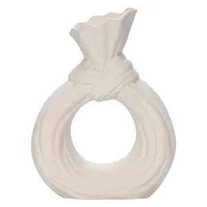 Elegant modern white ceramic donut vase with a ruffled neck for home decor and flowers