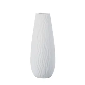 Minimalist white ceramic vase with vertical wavy texture for modern home decor accents
