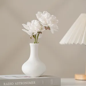 Modern minimalist white ceramic flower vase for home decor with an elegant matte finish