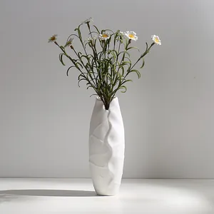 Modern minimalist white ceramic vase with unique crinkled texture for home decor