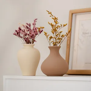 Modern minimalist ceramic vase set featuring dried flowers for elegant home decor