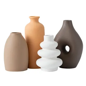 Creative set of minimalist ceramic vases in earthy tones for modern home tabletop decor