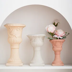 Roman column style ceramic vases for floral arrangement setup
