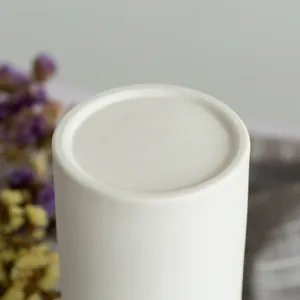 Top view detail of a minimalist white ceramic vase for elegant home floral arrangements