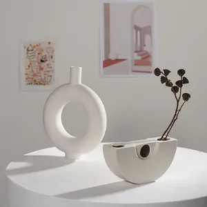 Minimalist Nordic white ceramic doughnut and moon-shaped vases for dried flower decor