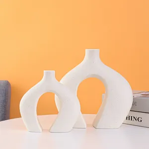 Modern minimalist white ceramic vases with a unique U-shaped design for home decor