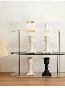 Assorted Nordic ceramic candlestick holders in black and white on a display shelf