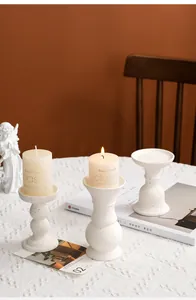 Modern ceramic candle holders with black speckles for cozy dining table decor aesthetic