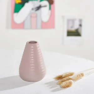 Nordic minimalist light pink ceramic vase with ribbed texture for home table centerpiece decoration