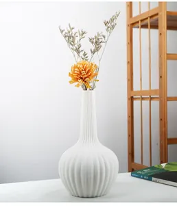 Elegant white ceramic vase with vertical ridges for minimalist home decor