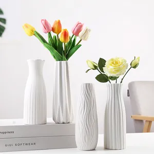 Modern white ceramic vases set with elegant fluted and wavy textures for home decor