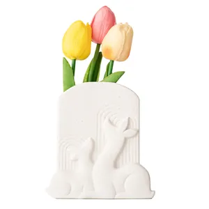 Elegant white arched ceramic vase featuring deer relief and colorful tulips decor