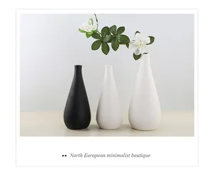 Detail view of matte ceramic vases set in elegant minimalist Nordic design for decor