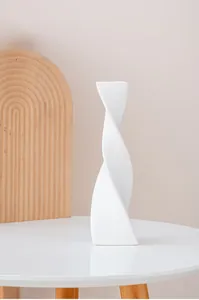 Modern white ceramic twisted vase with abstract minimalist design for home decor