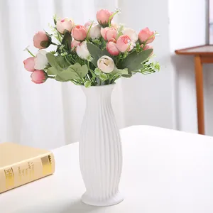 Minimalist white ceramic ribbed vase with elegant vertical stripes for home decor