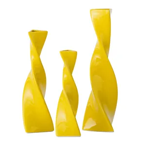 Modern yellow twisted ceramic vases set for minimalist home decor and floral display